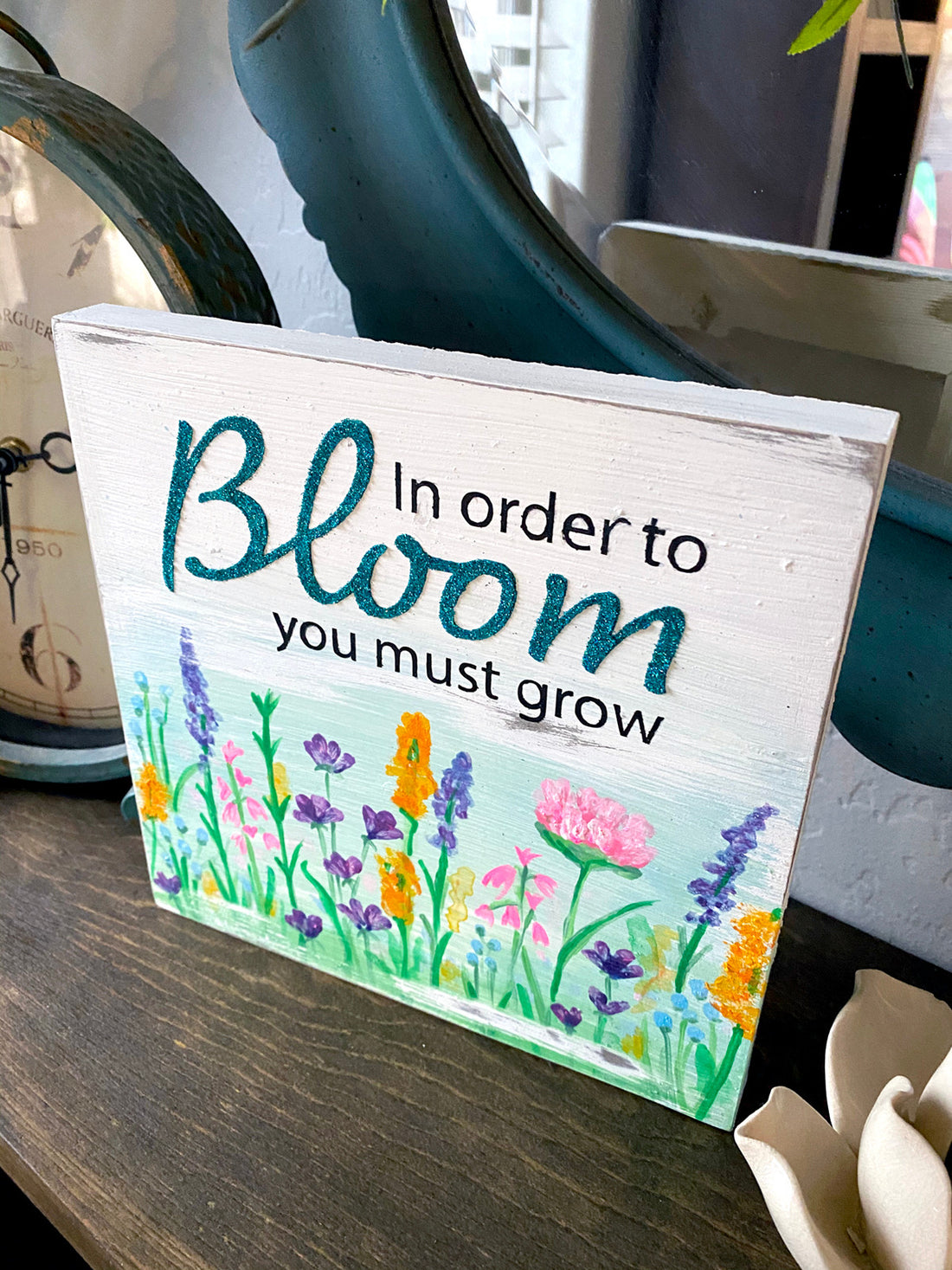In order to bloom you must grow wood sign